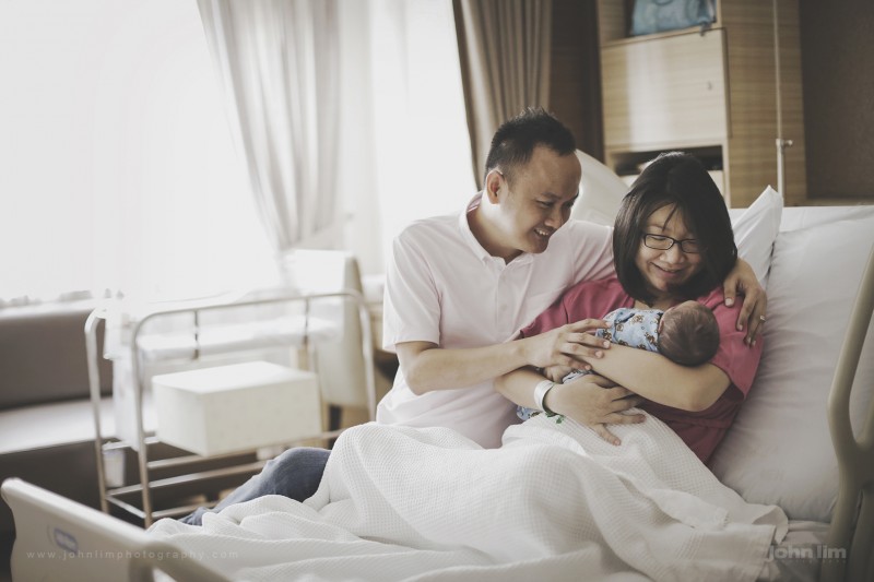 real authenic picture of a new family, the birth of a family with newborn baby at hospital first day